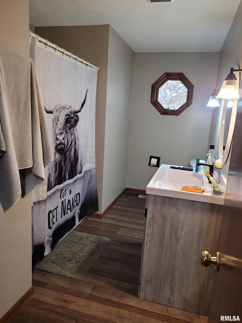 469 Main Street Radom, IL 62808 - Photo 16 of 23 a view of a hallway with paintings on the wall