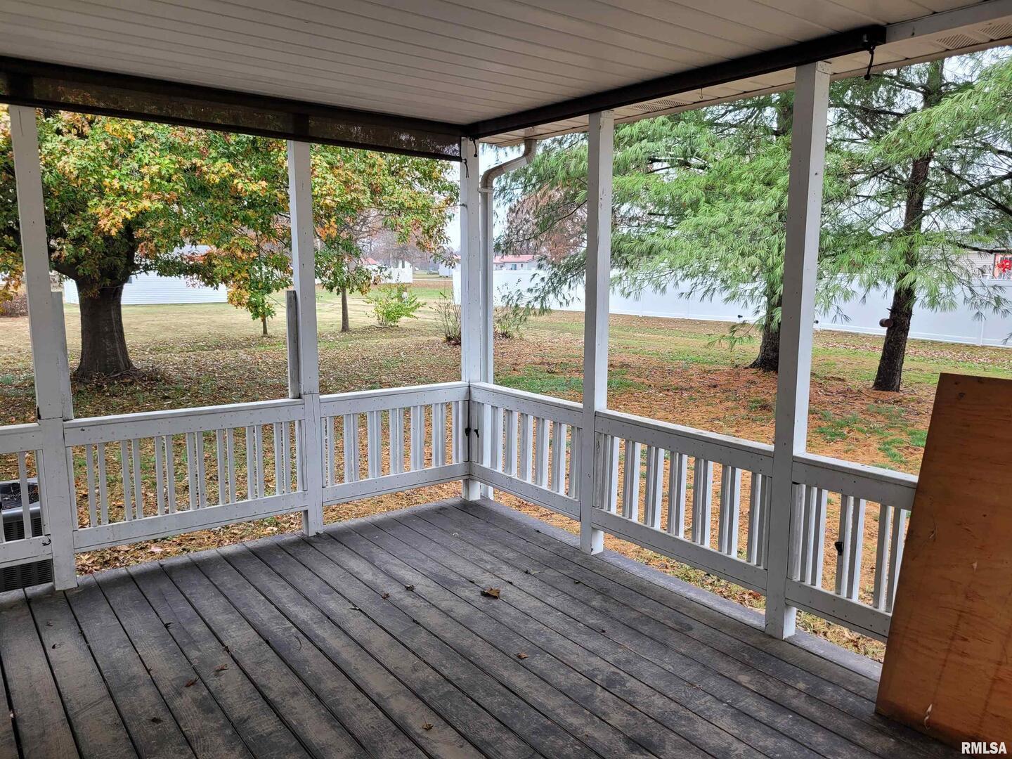 469 Main Street Radom, IL 62808 - Photo 18 of 23 a view of a wooden deck with a large window