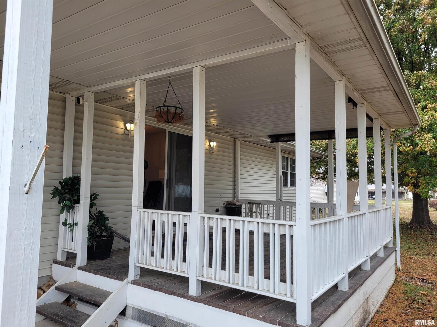 469 Main Street Radom, IL 62808 - Photo 19 of 23 a porch with a bench
