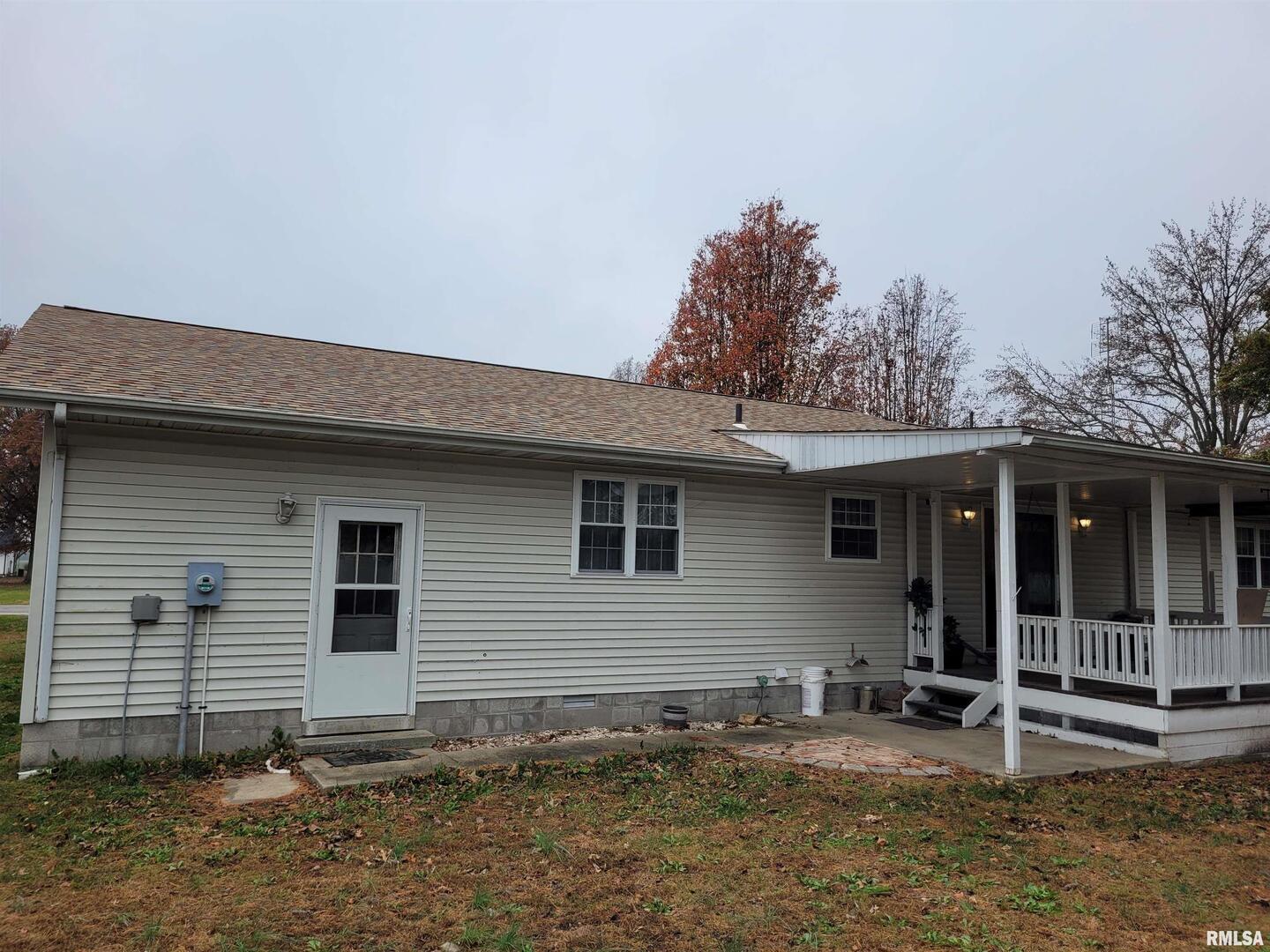 469 Main Street Radom, IL 62808 - Photo 20 of 23 a backyard of a house with table and chairs