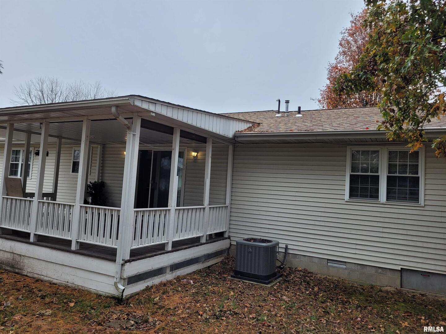 469 Main Street Radom, IL 62808 - Photo 21 of 23 a view of a small house with wooden floor and roof