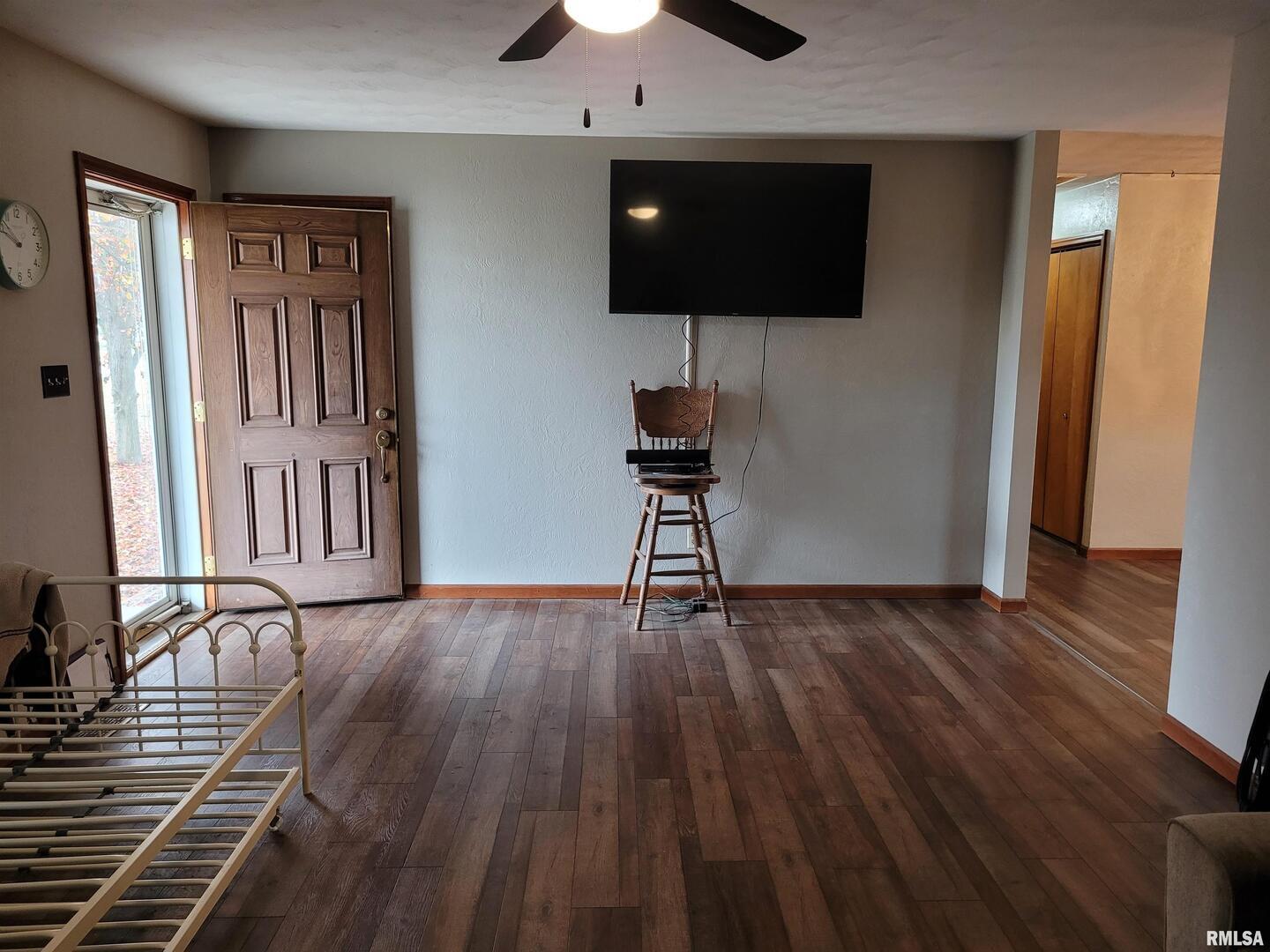 469 Main Street Radom, IL 62808 - Photo 5 of 23 a view of livingroom with hardwood floor and cabinet