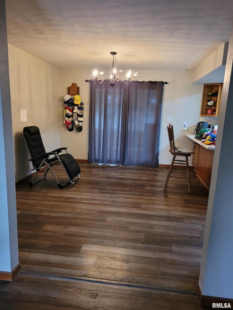 469 Main Street Radom, IL 62808 - Photo 6 of 23 a view of a room with toys and wooden floor