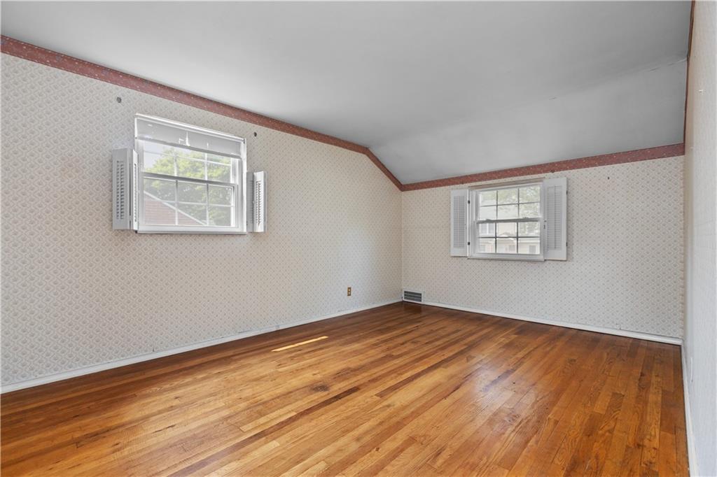 442 Serrano Avenue Pittsburgh, PA 15228 - Photo 16 of 31 a view of an empty room with wooden floor and a window