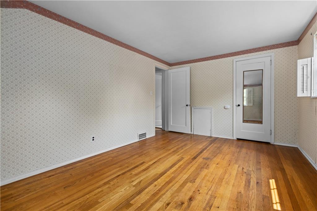 442 Serrano Avenue Pittsburgh, PA 15228 - Photo 17 of 31 a view of empty room with wooden floor and fan