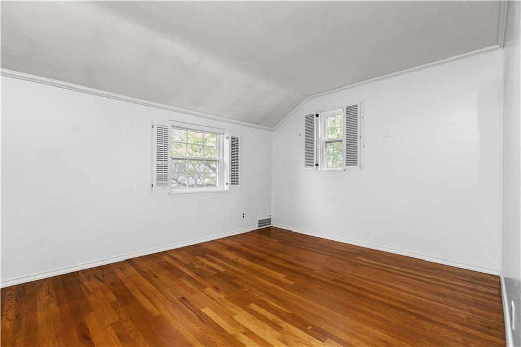 442 Serrano Avenue Pittsburgh, PA 15228 - Photo 18 of 31 an empty room with wooden floor and windows