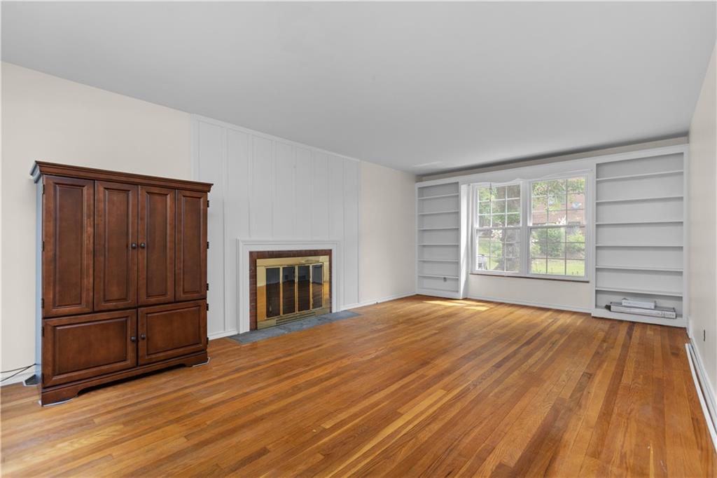 442 Serrano Avenue Pittsburgh, PA 15228 - Photo 2 of 31 a view of a livingroom with wooden floor kitchen and a window