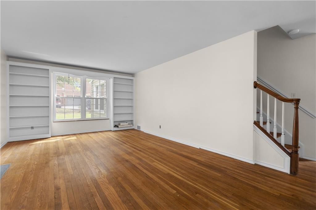 442 Serrano Avenue Pittsburgh, PA 15228 - Photo 3 of 31 a view of an empty room with wooden floor and a window