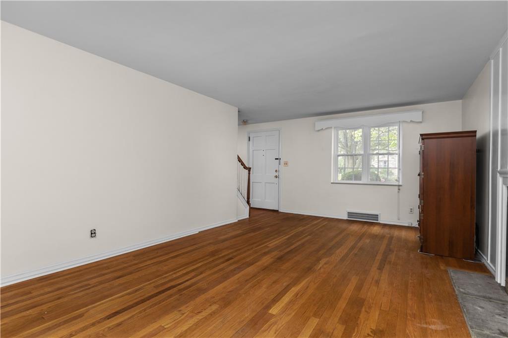 442 Serrano Avenue Pittsburgh, PA 15228 - Photo 5 of 31 wooden floor in an empty room with a window