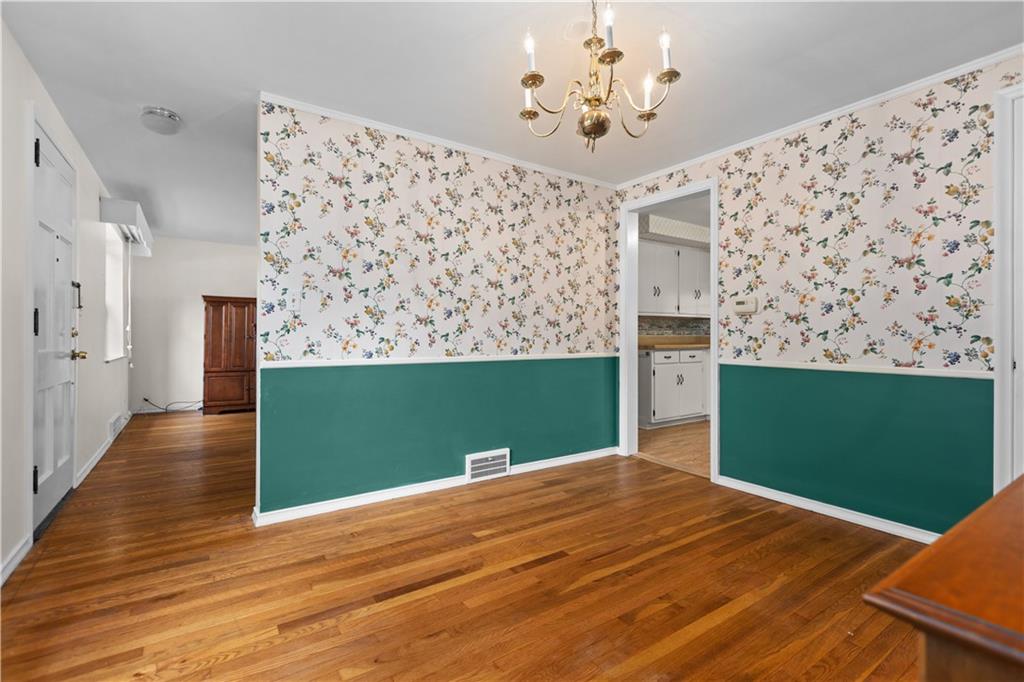 442 Serrano Avenue Pittsburgh, PA 15228 - Photo 7 of 31 a view of a room with window wooden floor and a kitchen