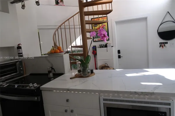 a kitchen with a stove and a sink