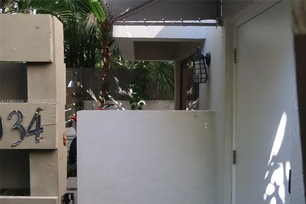 a view of swimming pool with seating space