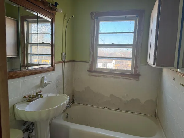 a bathroom with a sink and a bathtub
