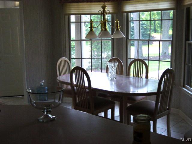 1012 Stone Stack Drive Bethlehem, PA 18015 - Photo 4 of 18 a dining room with furniture a chandelier and wooden floor