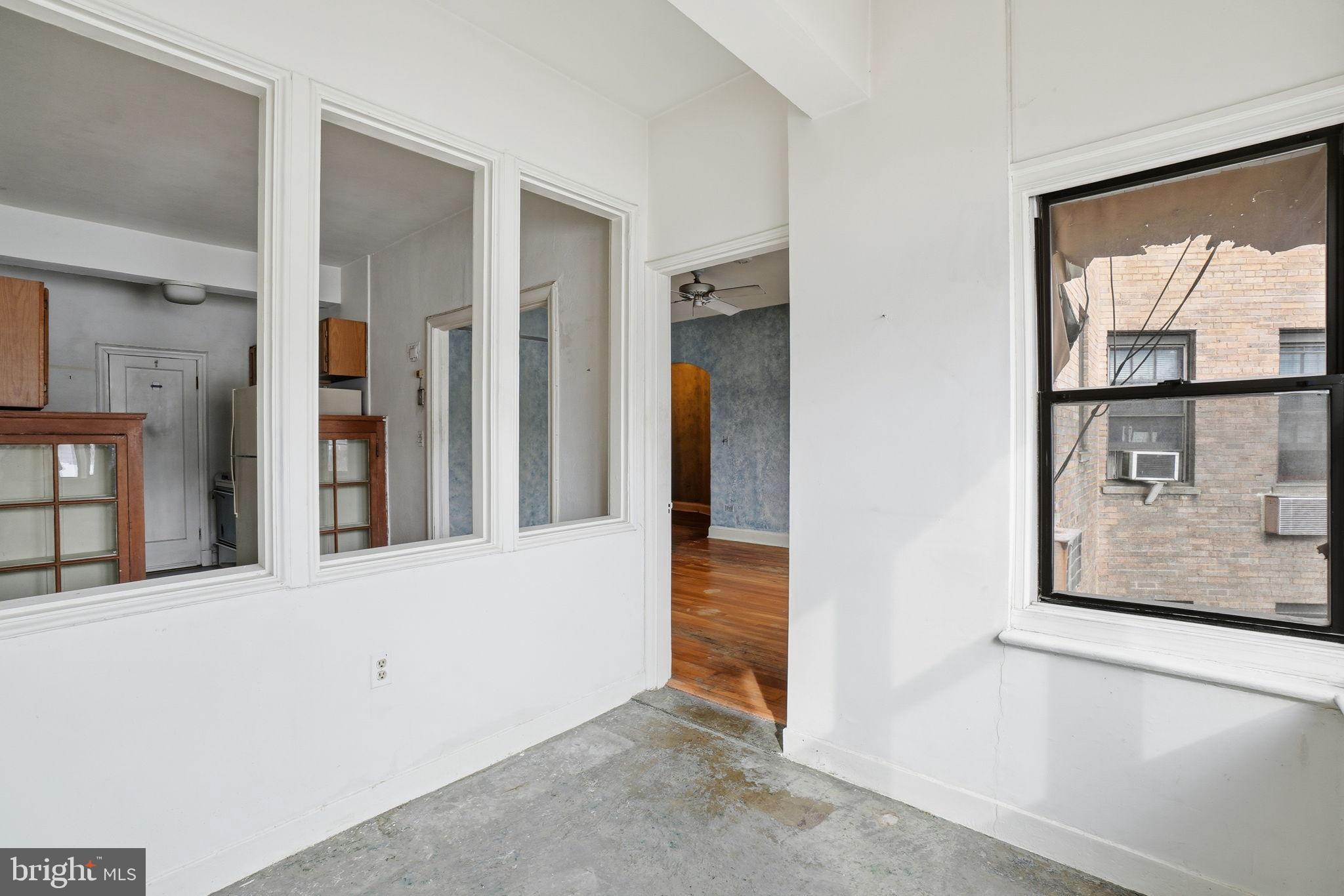 2040 Belmont Road Northwest, Unit 536 Washington, DC 20009 - Photo 14 of 31 an entryway with wooden floor and windows