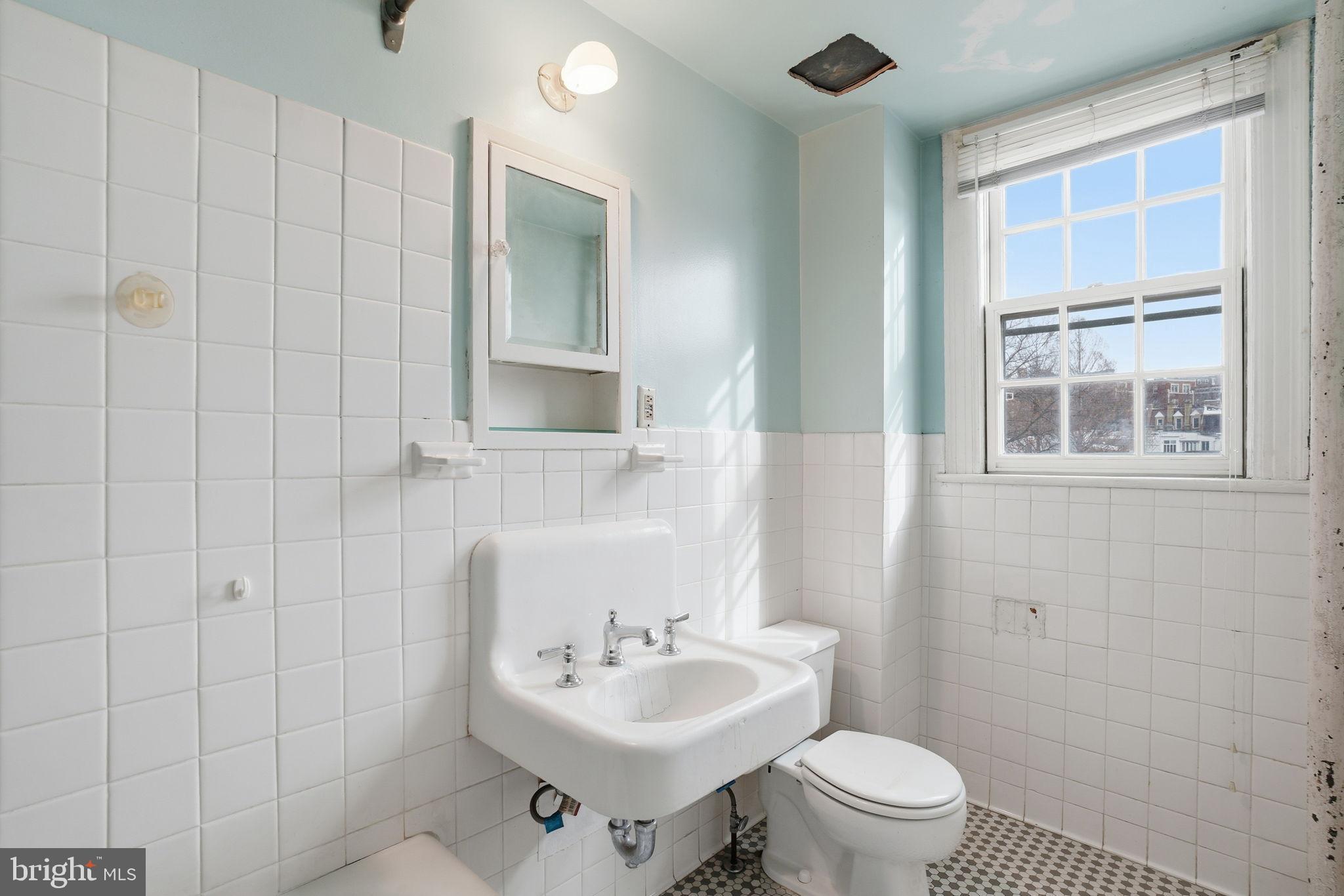 2040 Belmont Road Northwest, Unit 536 Washington, DC 20009 - Photo 17 of 25 Bright and airy bathroom with vintage charm.