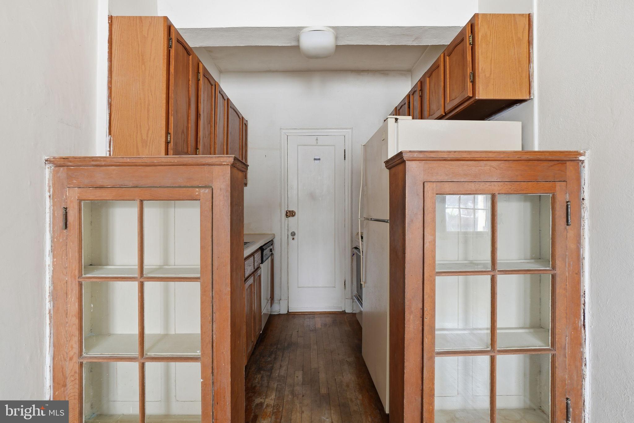 2040 Belmont Road Northwest, Unit 536 Washington, DC 20009 - Photo 18 of 31 a view of a hallway with wooden floor and entryway