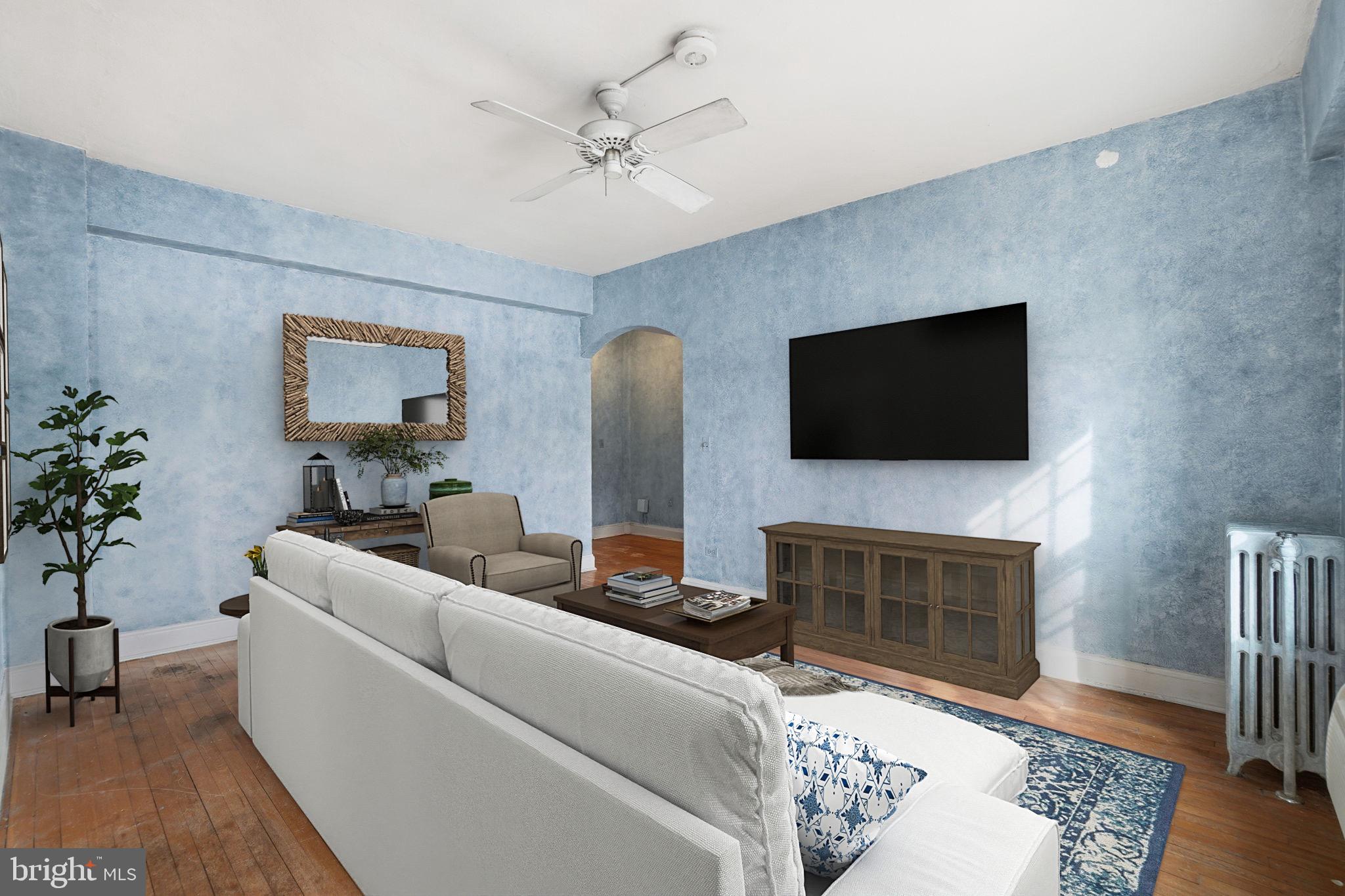 2040 Belmont Road Northwest, Unit 536 Washington, DC 20009 - Photo 2 of 31 a living room with fireplace furniture and a flat screen tv