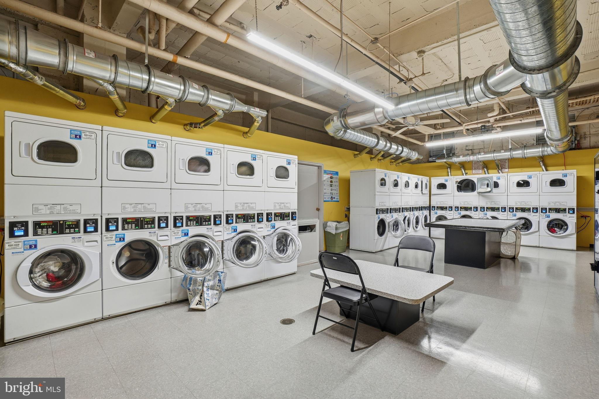 2040 Belmont Road Northwest, Unit 536 Washington, DC 20009 - Photo 21 of 25 Bright and spacious laundry facility.