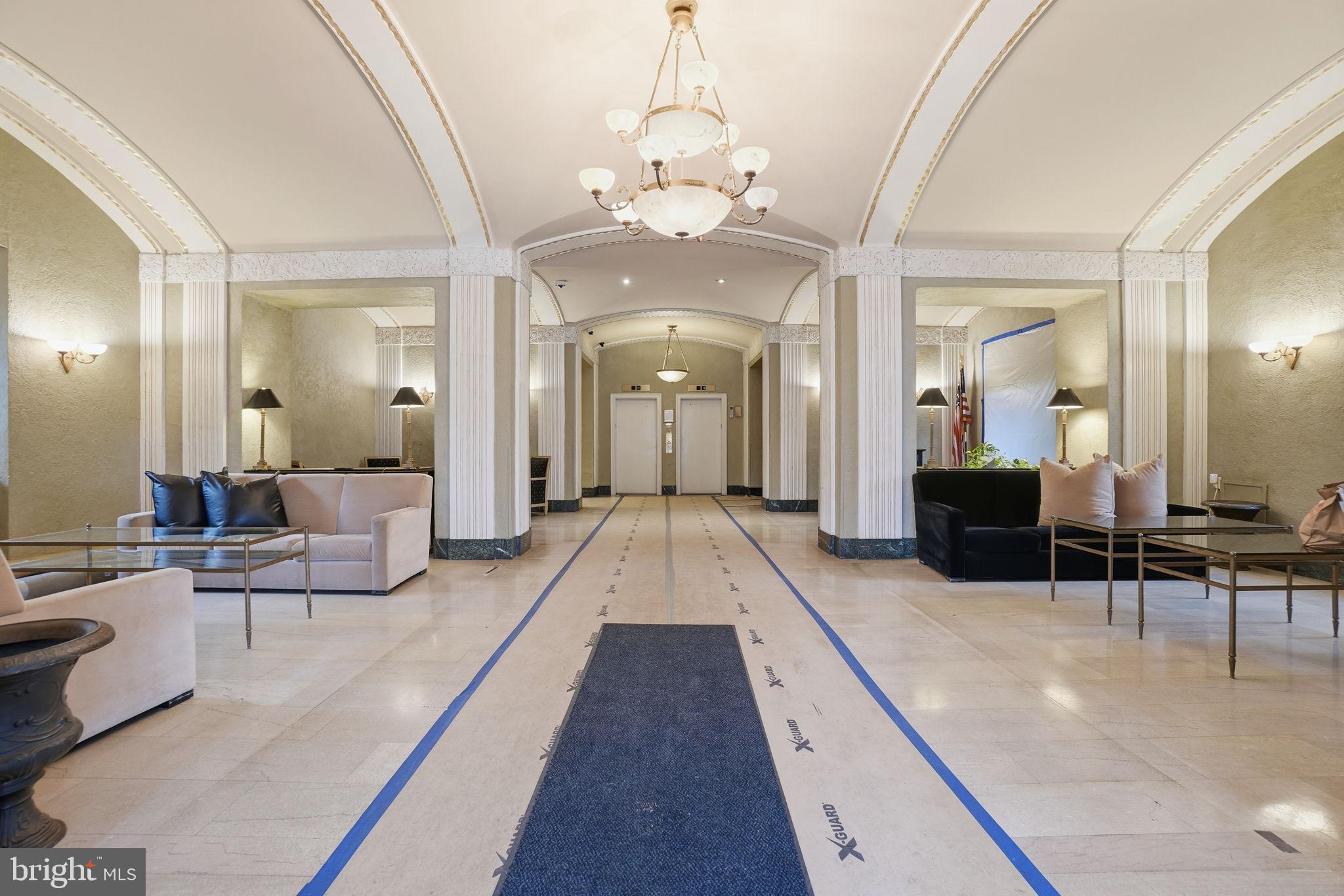 2040 Belmont Road Northwest, Unit 536 Washington, DC 20009 - Photo 27 of 31 a lobby with furniture and a chandelier