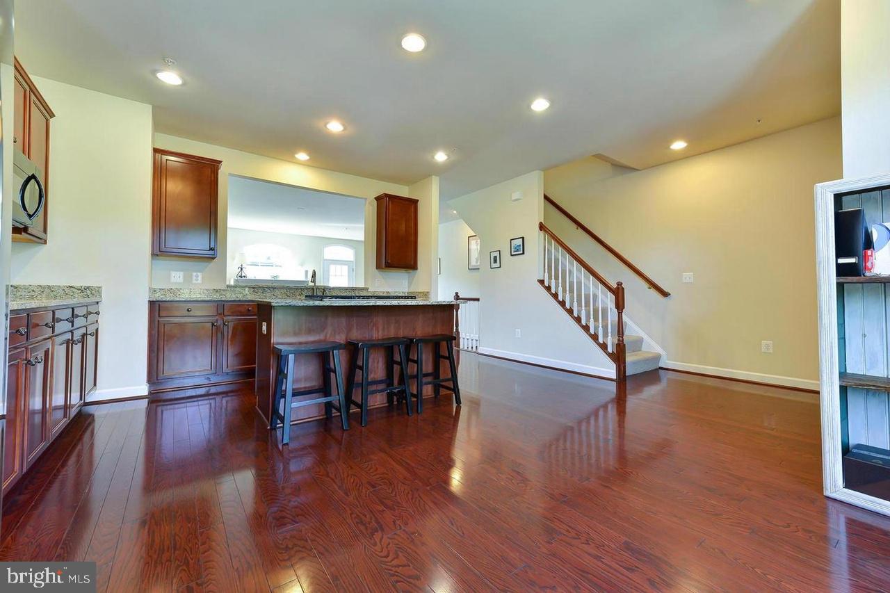 8017 Sport View Road Landover, MD 20785 - Photo 12 of 21 a view of kitchen with cabinets and wooden floor