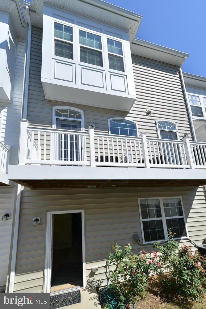 8017 Sport View Road Landover, MD 20785 - Photo 19 of 21 a front view of a house with windows