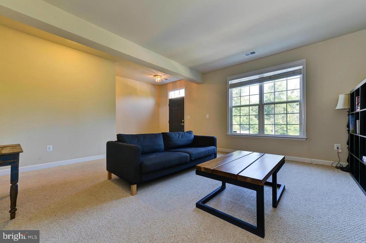 8017 Sport View Road Landover, MD 20785 - Photo 3 of 21 a living room with furniture and a window