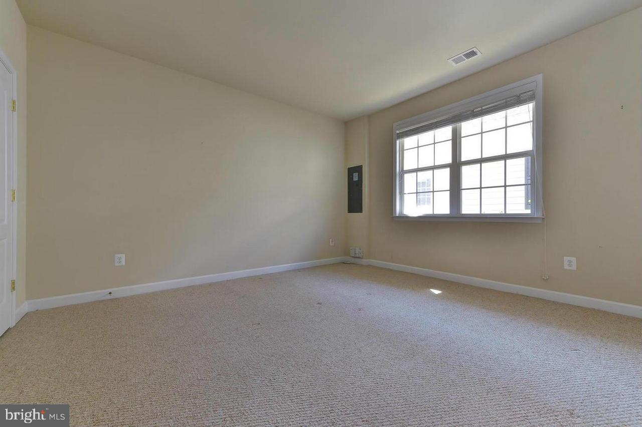 8017 Sport View Road Landover, MD 20785 - Photo 4 of 21 an empty room with a window