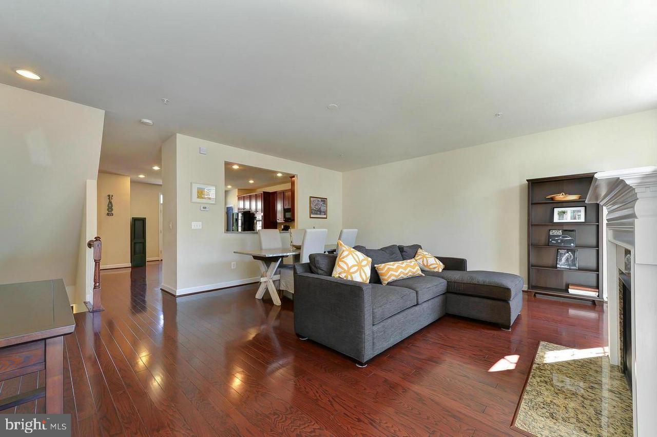 8017 Sport View Road Landover, MD 20785 - Photo 6 of 21 a living room with furniture and wooden floor