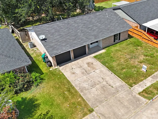 a aerial view of a house with a yard