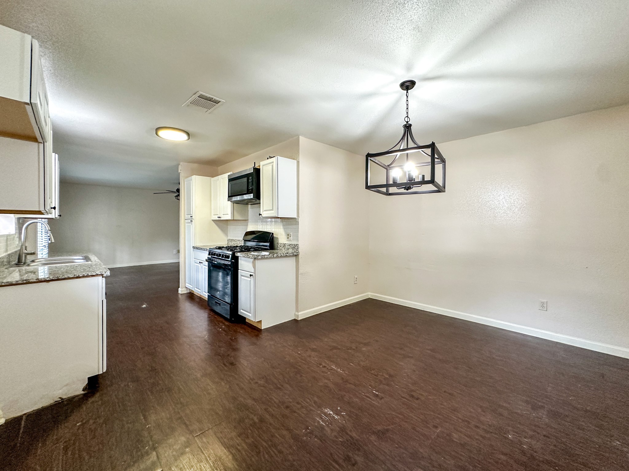 3619 Darling Avenue Pasadena, TX 77503 - Photo 6 of 14 a kitchen with a refrigerator and a sink