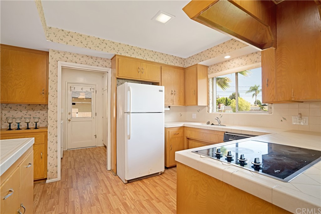 365 Fairview Avenue Arcadia, CA 91007 - Photo 13 of 36 a kitchen with a refrigerator a sink and a stove top oven