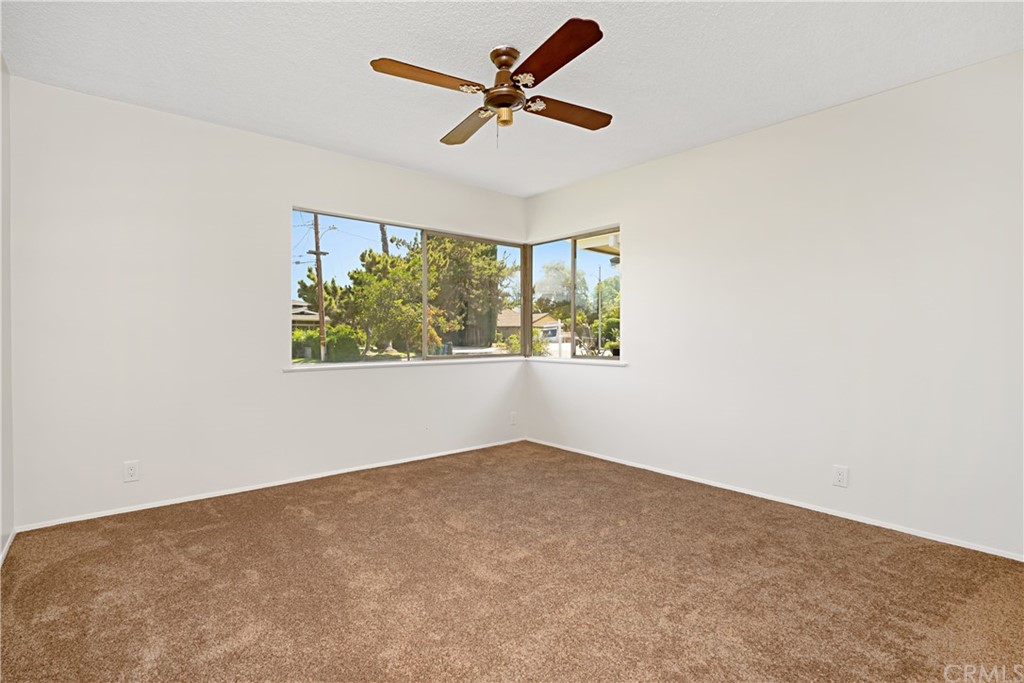 365 Fairview Avenue Arcadia, CA 91007 - Photo 19 of 36 an empty room with windows and ceiling fan