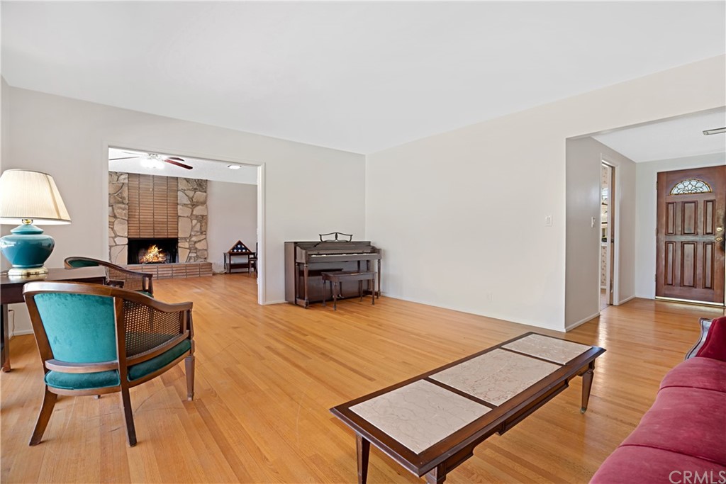 365 Fairview Avenue Arcadia, CA 91007 - Photo 6 of 36 a living room with furniture a table and wooden floor
