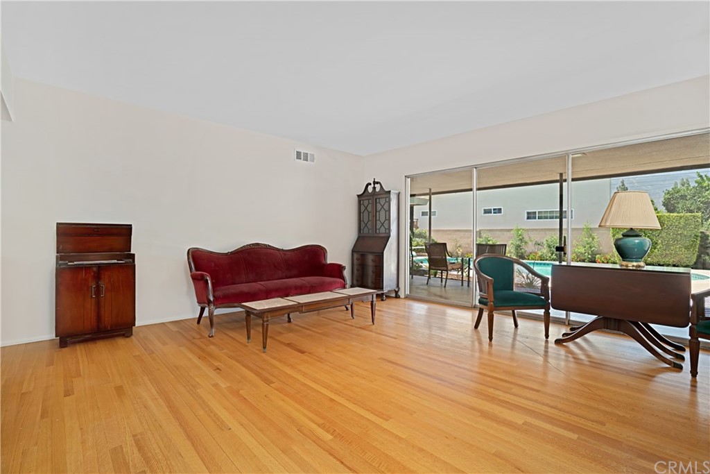 365 Fairview Avenue Arcadia, CA 91007 - Photo 7 of 36 a living room with furniture a table and wooden floor