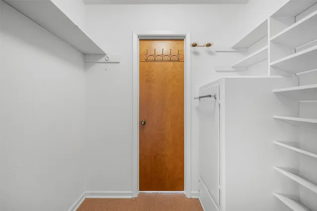 a view of livingroom with furniture and closet