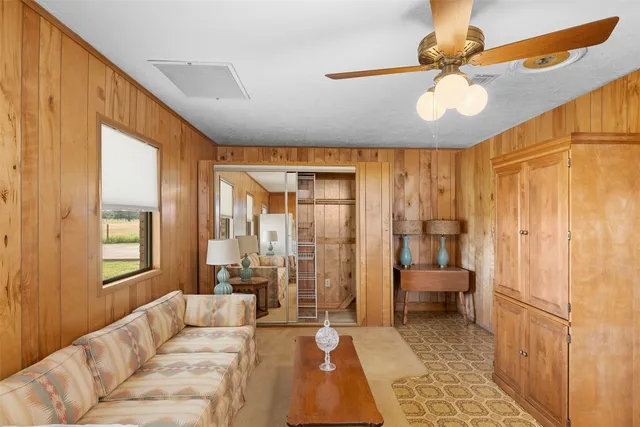 a kitchen with stainless steel appliances granite countertop a dining table and chairs