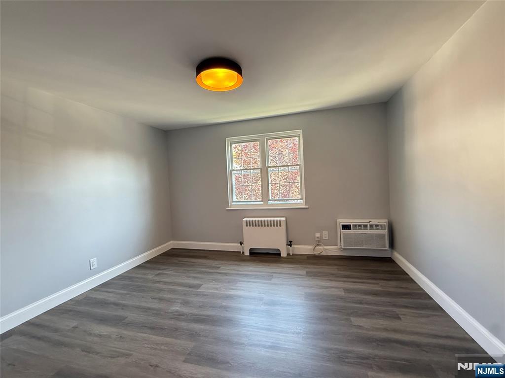 20 Clark Court Rutherford, NJ 07070 - Photo 18 of 29 a view of empty room with wooden floor and fan