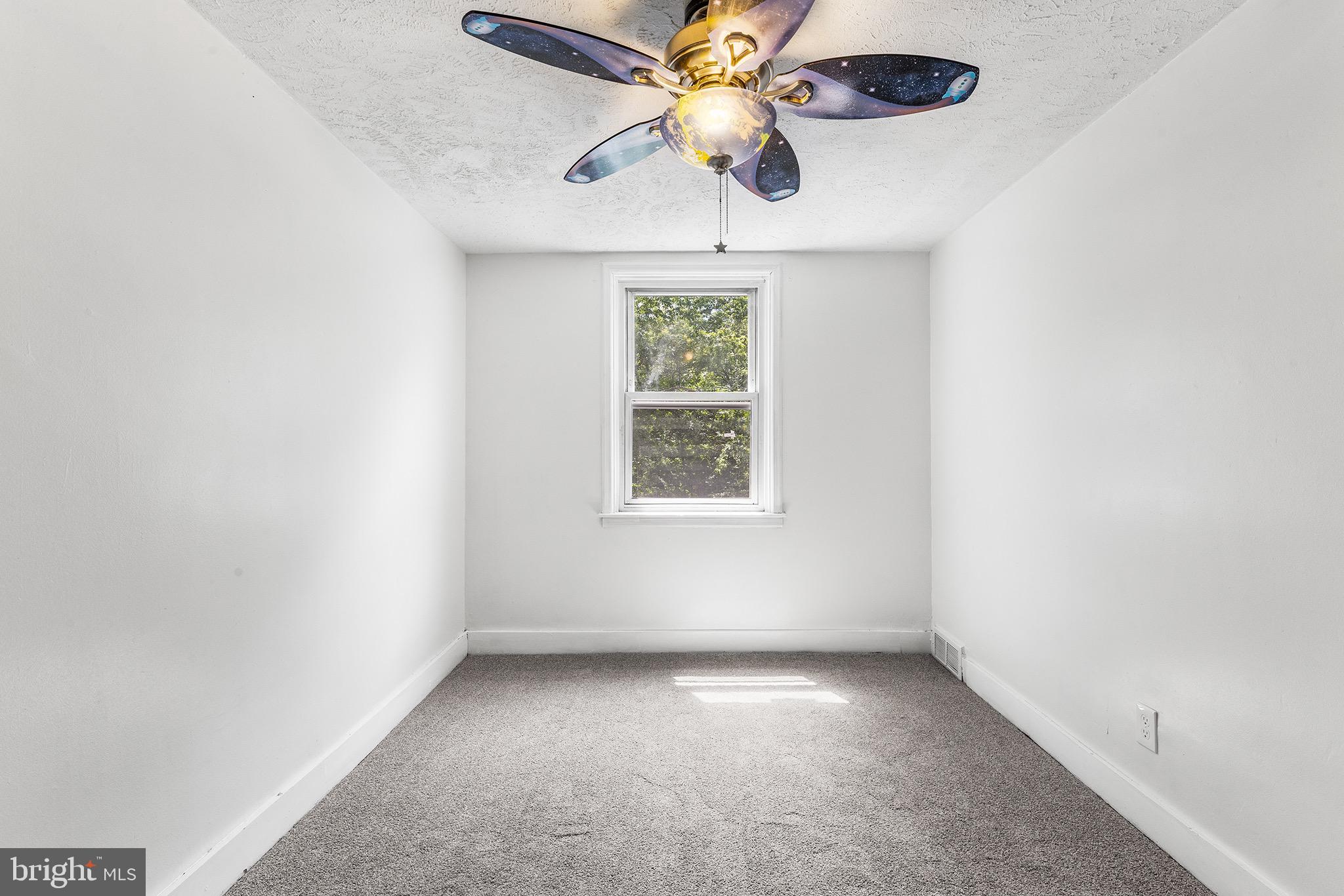 390 Glen Cove Road Collingdale, PA 19023 - Photo 23 of 27 an empty room with a window and a fan
