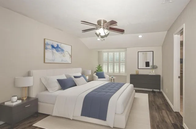 a bedroom with bed and window