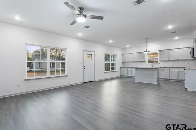 a view of kitchen with wooden floor and window