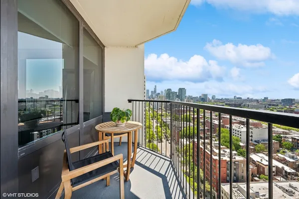 a view of a balcony with furniture