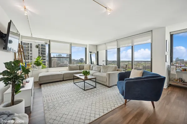 a living room with furniture and a large window