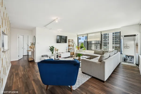 a living room with furniture and a large window