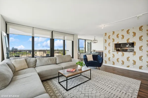 a living room with furniture and a large window