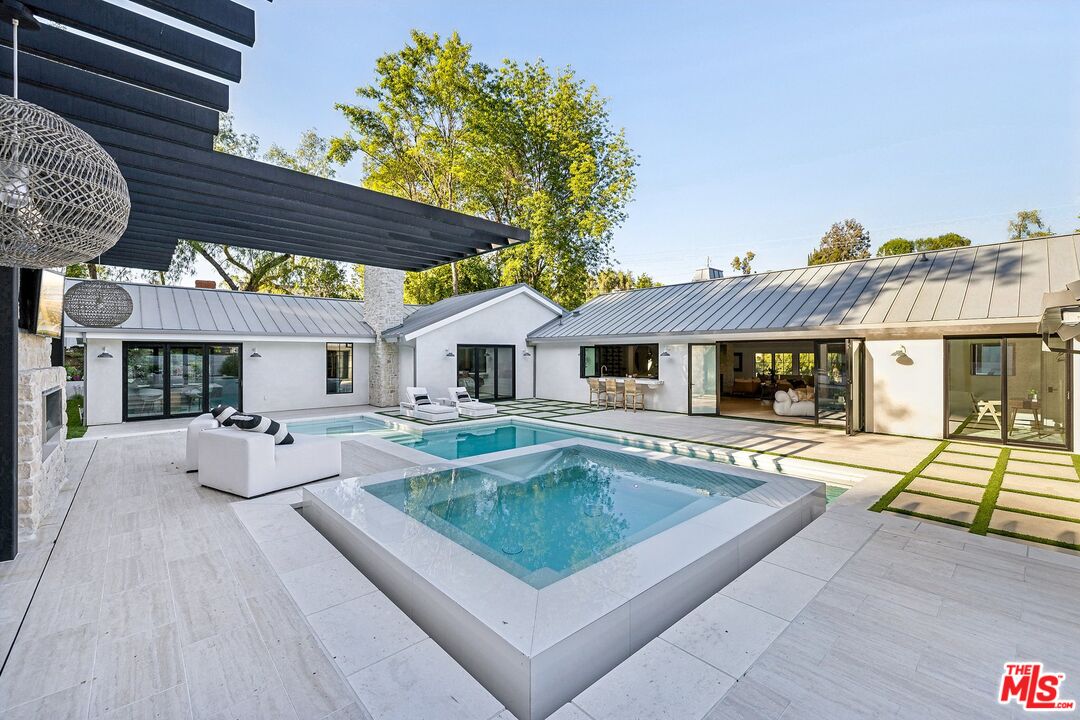 5565 Jed Smith Road Hidden Hills, CA 91302 - Photo 1 of 46 a view of house with swimming pool outdoor seating