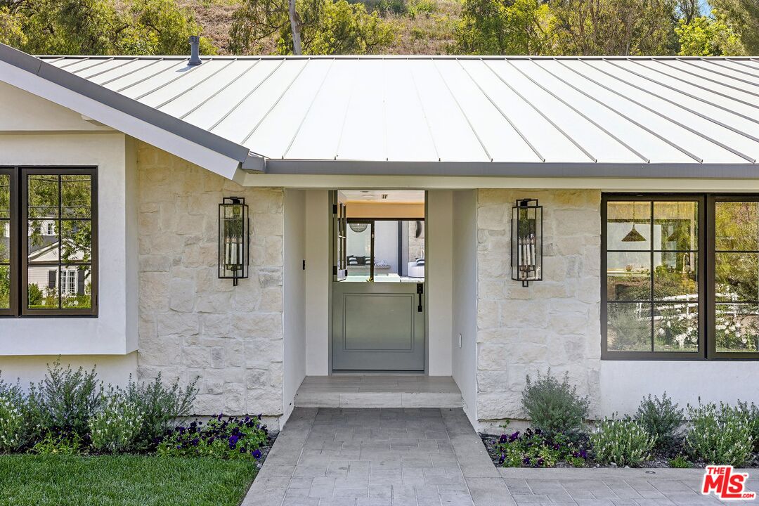 5565 Jed Smith Road Hidden Hills, CA 91302 - Photo 12 of 46 a bathroom with a sink and mirror