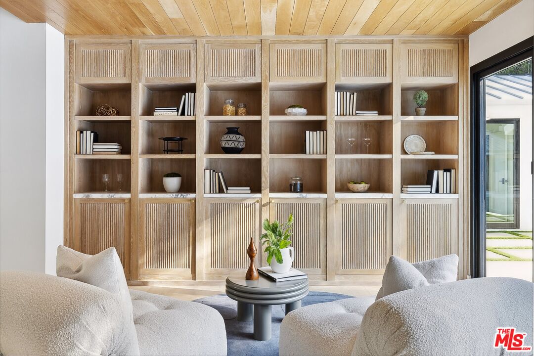 5565 Jed Smith Road Hidden Hills, CA 91302 - Photo 16 of 46 a living room with furniture and window