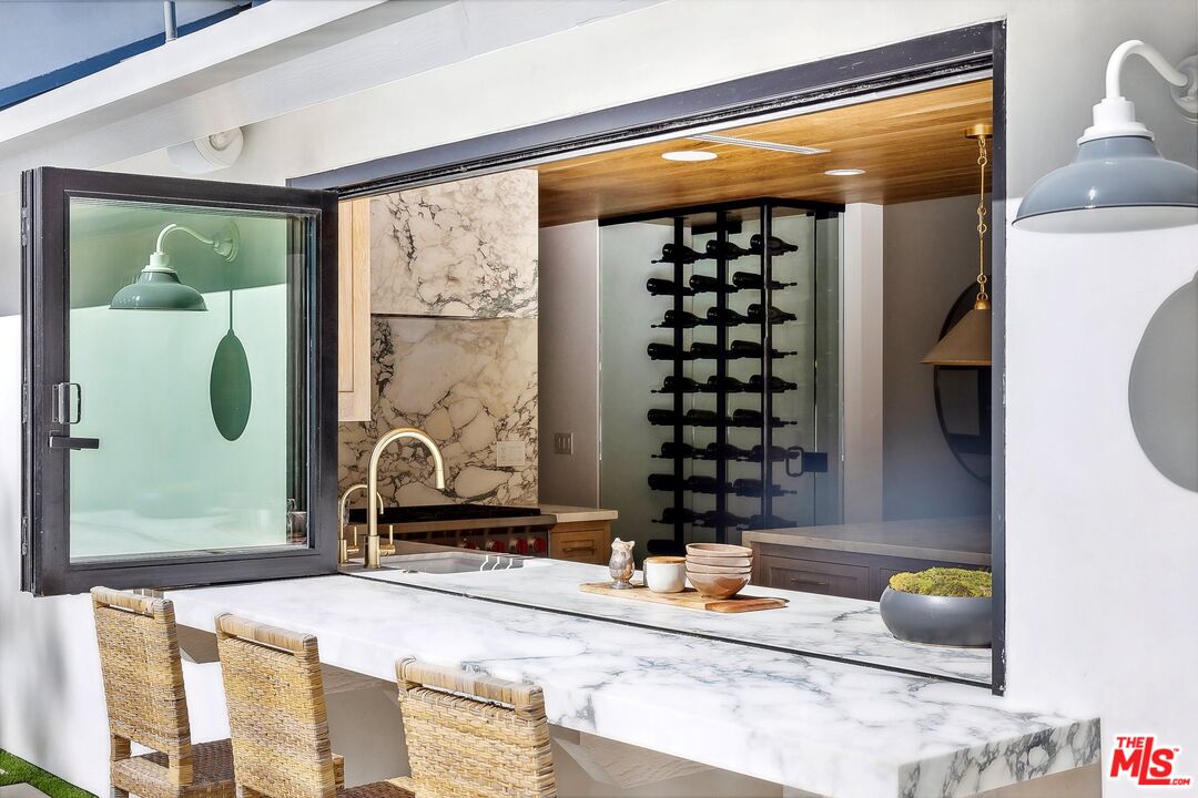 5565 Jed Smith Road Hidden Hills, CA 91302 - Photo 23 of 46 a bathroom with a granite countertop sink and a mirror