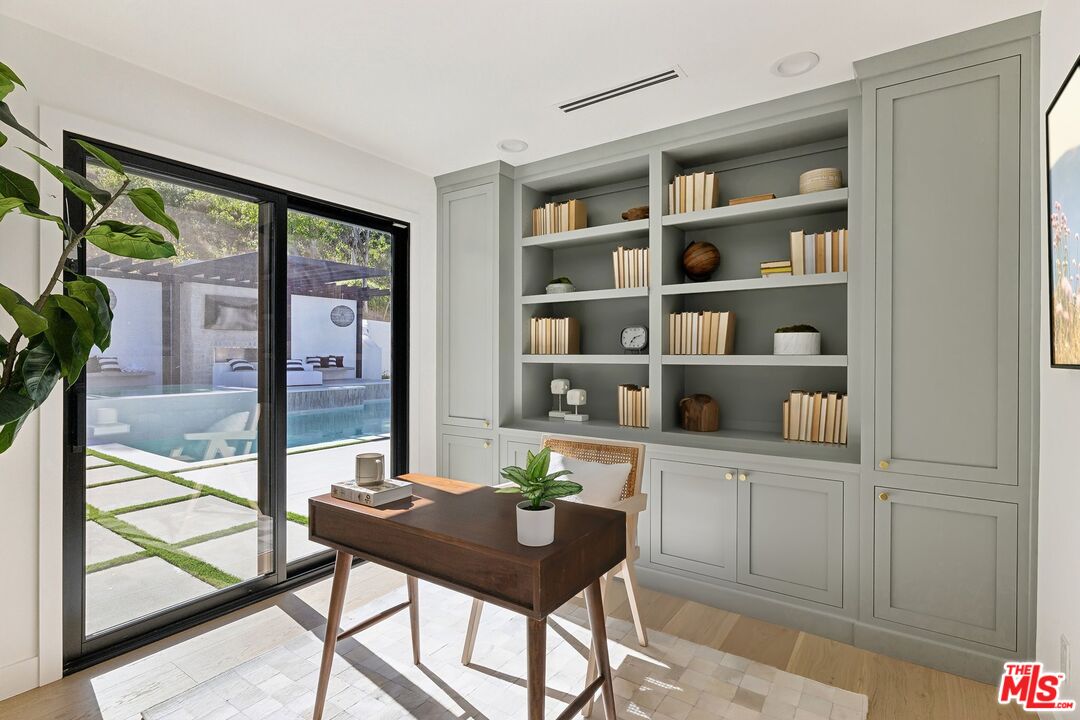 5565 Jed Smith Road Hidden Hills, CA 91302 - Photo 27 of 46 a view of a workspace with furniture and a potted plant